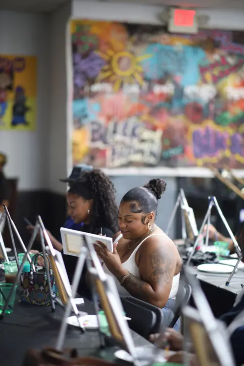Two friends painting side by side