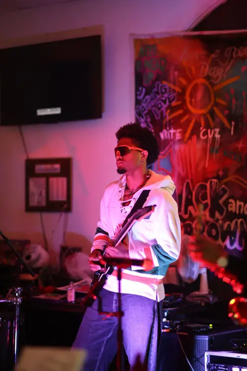 Guitarist in sunglasses performing